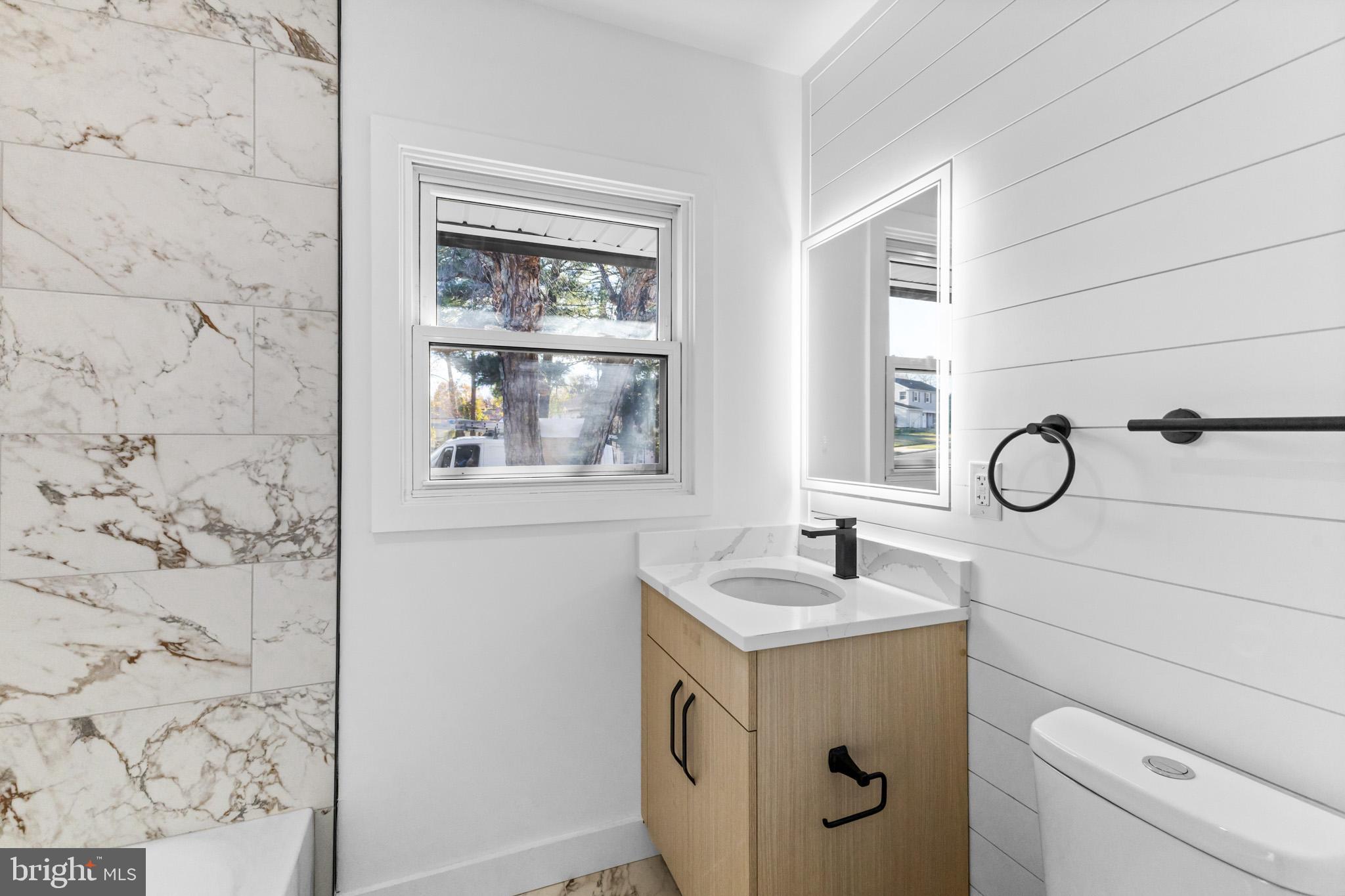 5 Perennial Lane Willingboro, NJ 08046 - Photo 21 of 52 a bathroom with a granite countertop sink a toilet and a mirror