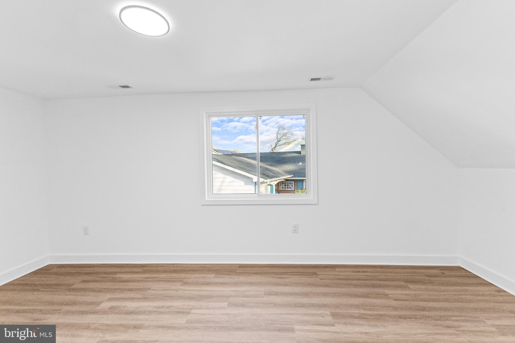 5 Perennial Lane Willingboro, NJ 08046 - Photo 26 of 52 an empty room with wooden floor and windows