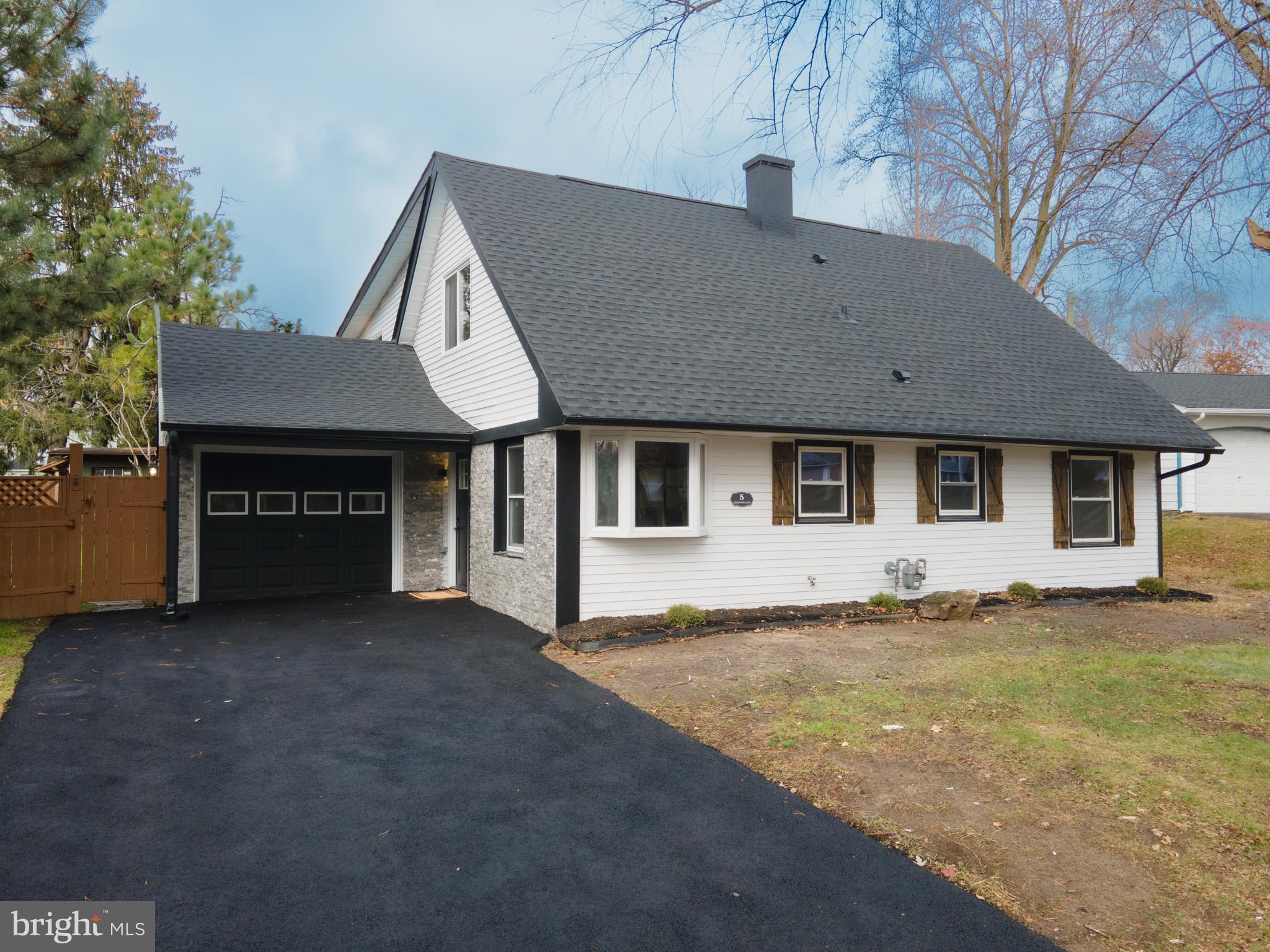 5 Perennial Lane Willingboro, NJ 08046 - Photo 3 of 52 a front view of a house with a garden