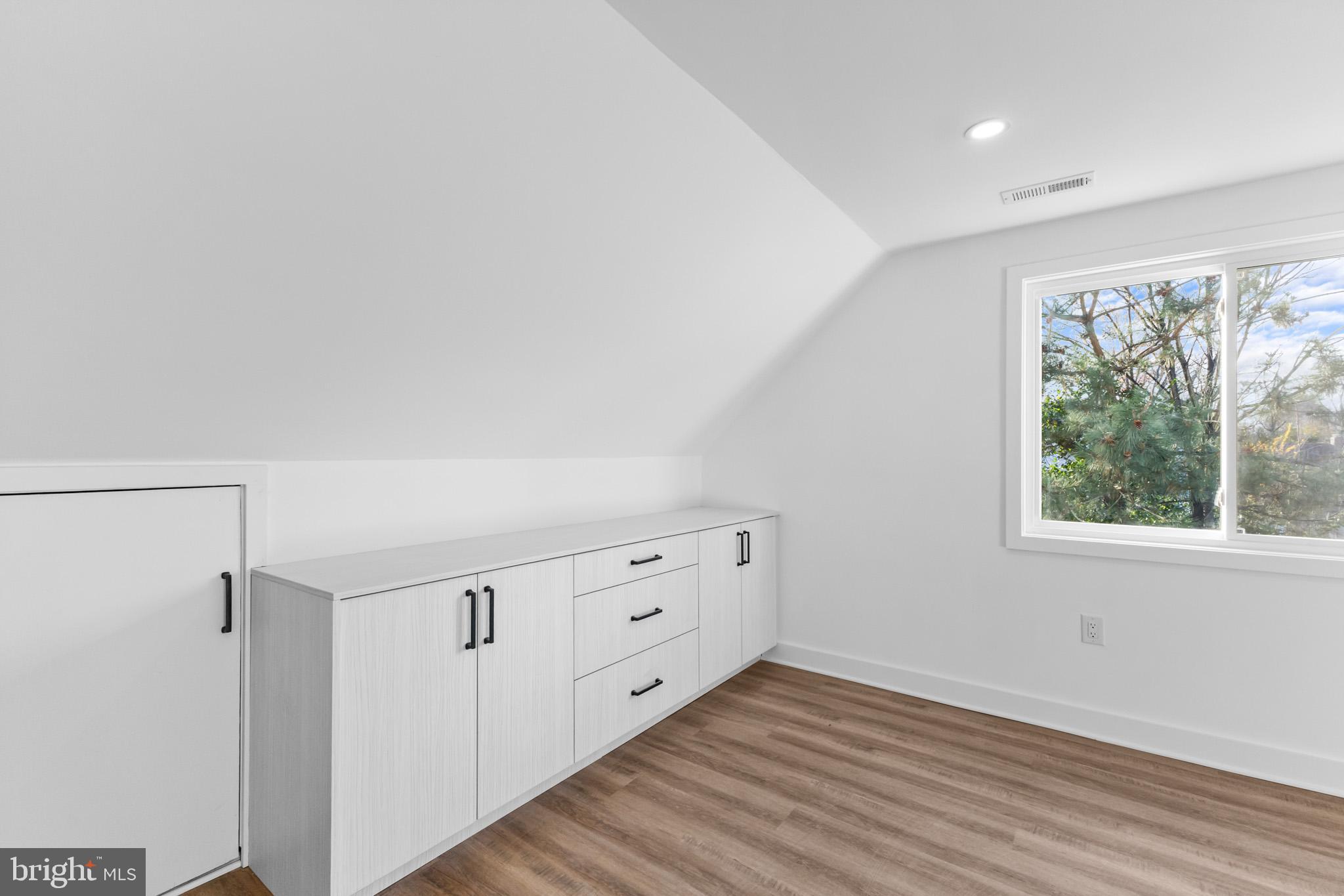 5 Perennial Lane Willingboro, NJ 08046 - Photo 34 of 52 a view of an empty room with wooden floor and a window