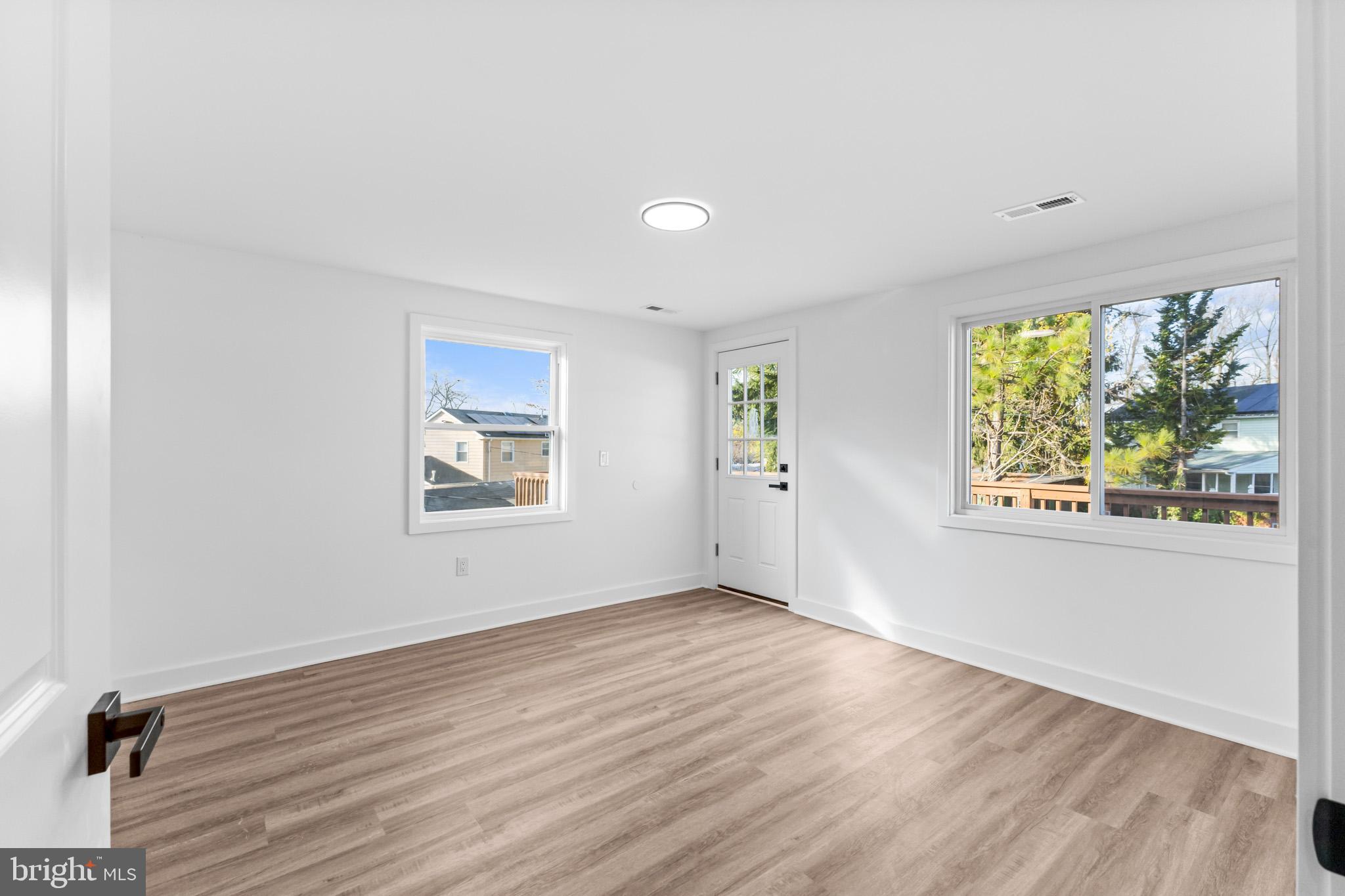 5 Perennial Lane Willingboro, NJ 08046 - Photo 35 of 52 a view of an empty room with wooden floor and a window