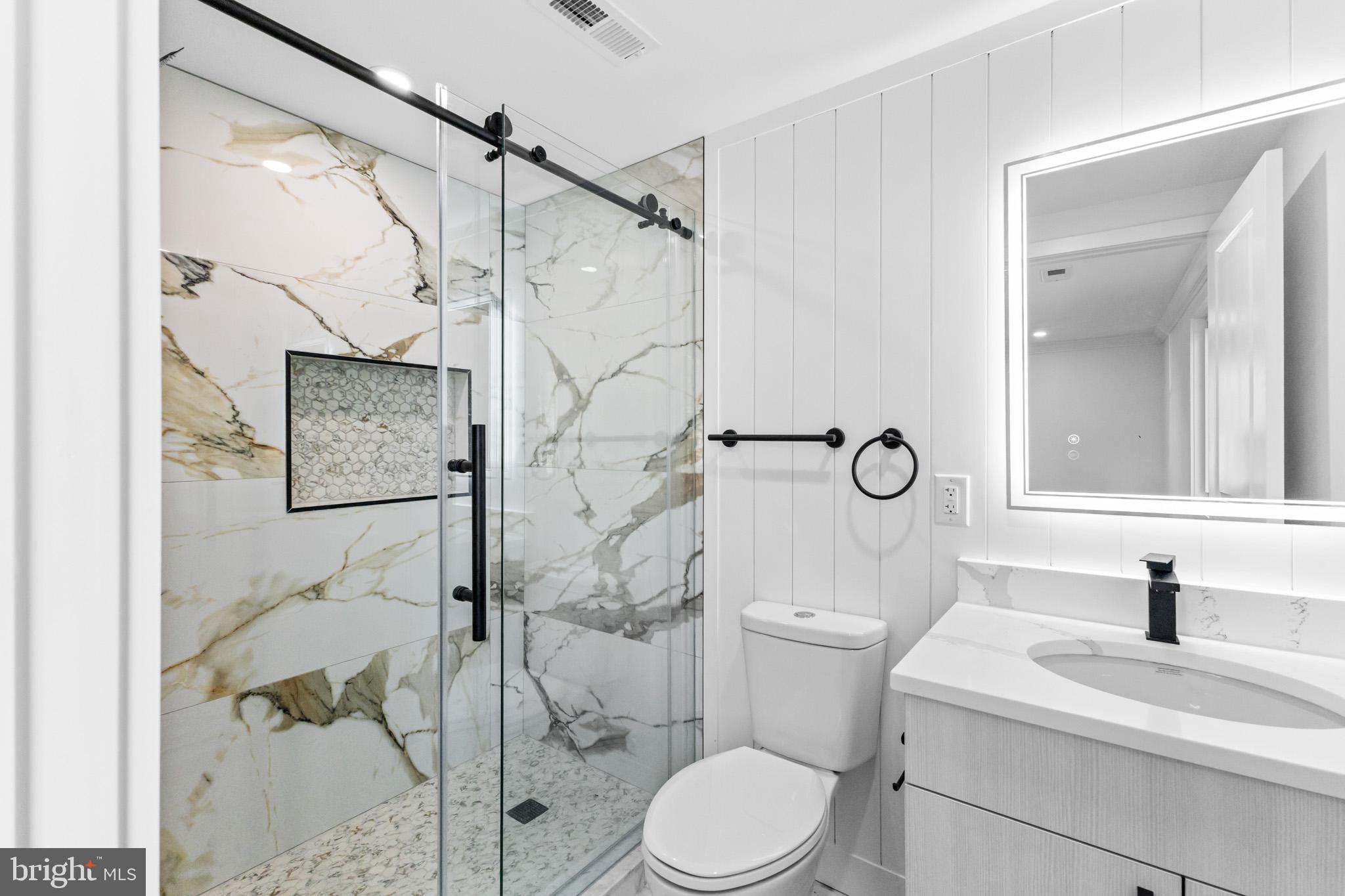 5 Perennial Lane Willingboro, NJ 08046 - Photo 41 of 52 a bathroom with a toilet sink and shower