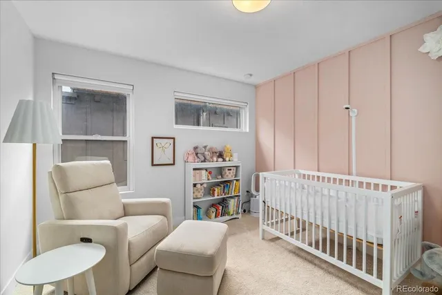 a bedroom with a bed and a book shelf