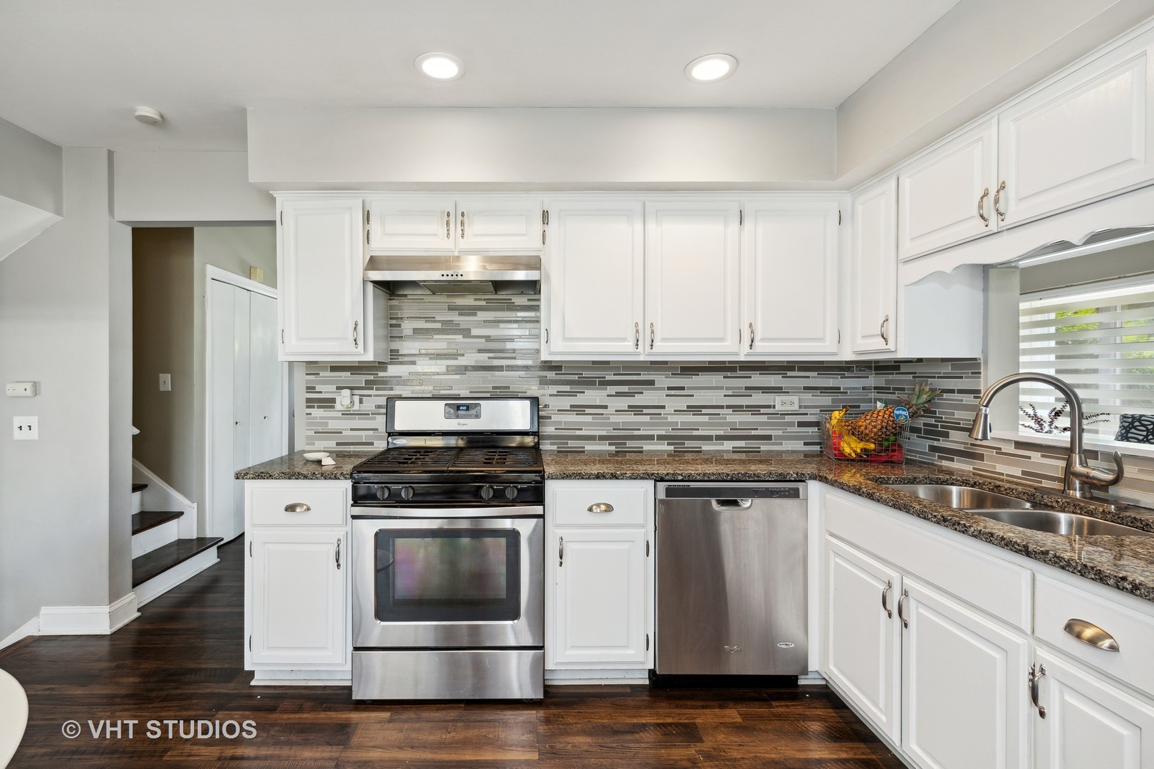 18724 Loomis Avenue Homewood, IL 60430 - Photo 4 of 11 a kitchen with stainless steel appliances white cabinets and a granite counter tops