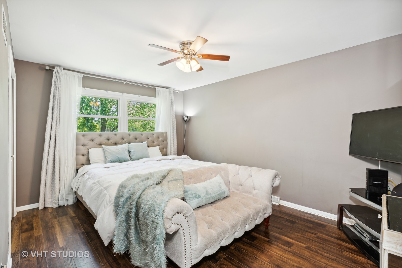 18724 Loomis Avenue Homewood, IL 60430 - Photo 9 of 11 a bedroom with a bed and a flat screen tv