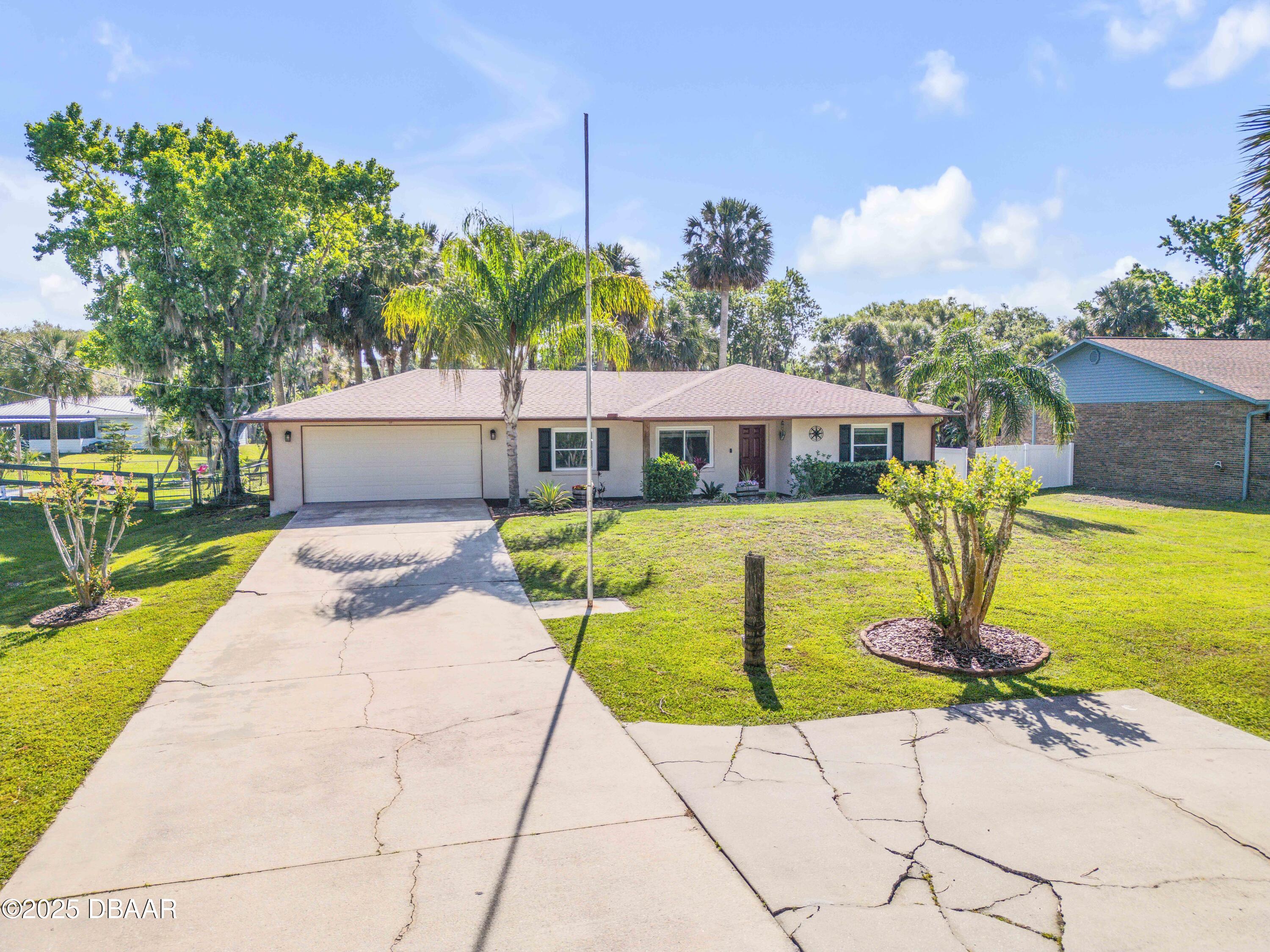 1617 Hontoon Road DeLand, FL 32720 - Photo 1 of 43 a view of a swimming pool with a patio