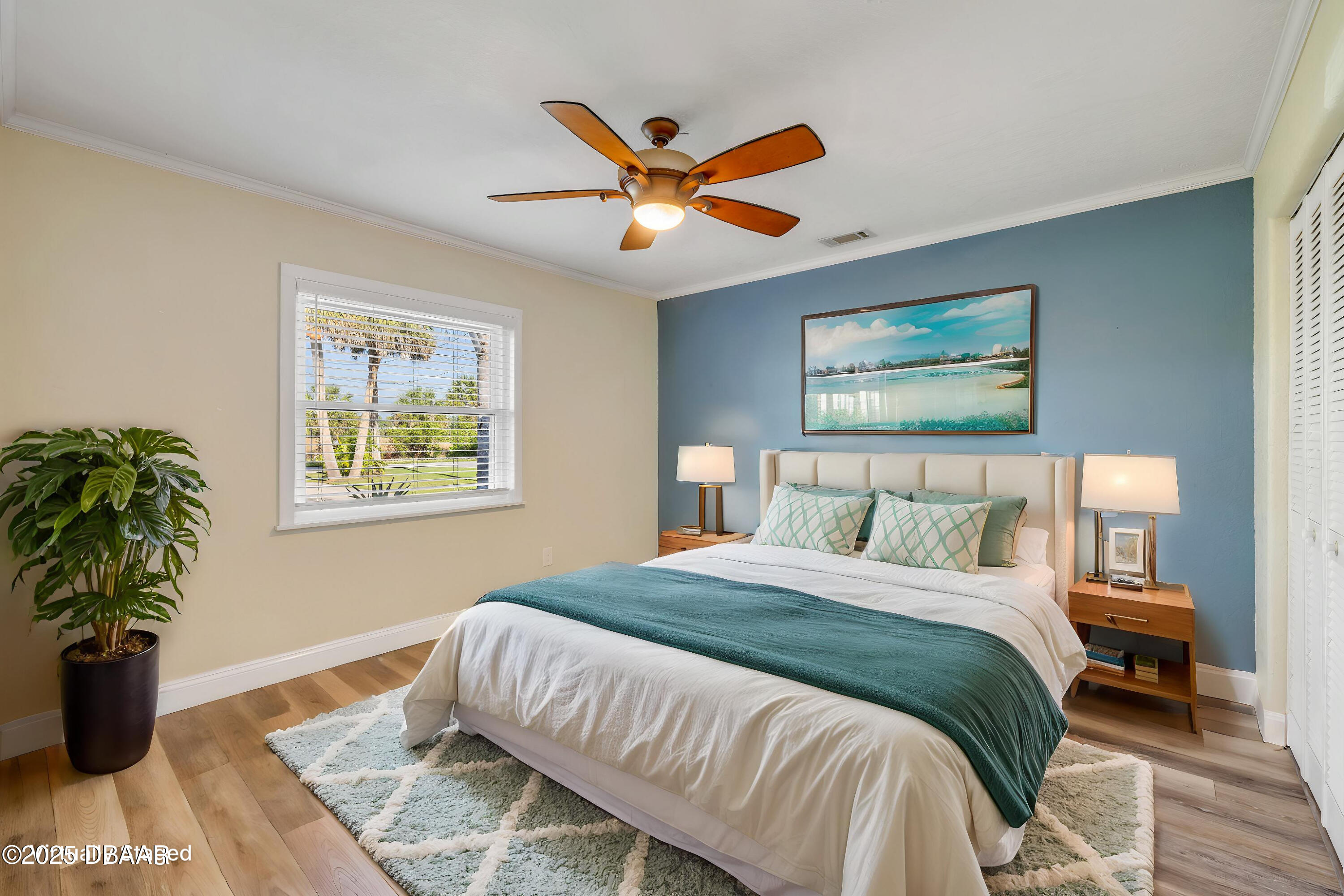 1617 Hontoon Road DeLand, FL 32720 - Photo 15 of 43 a bedroom with a large bed and a window