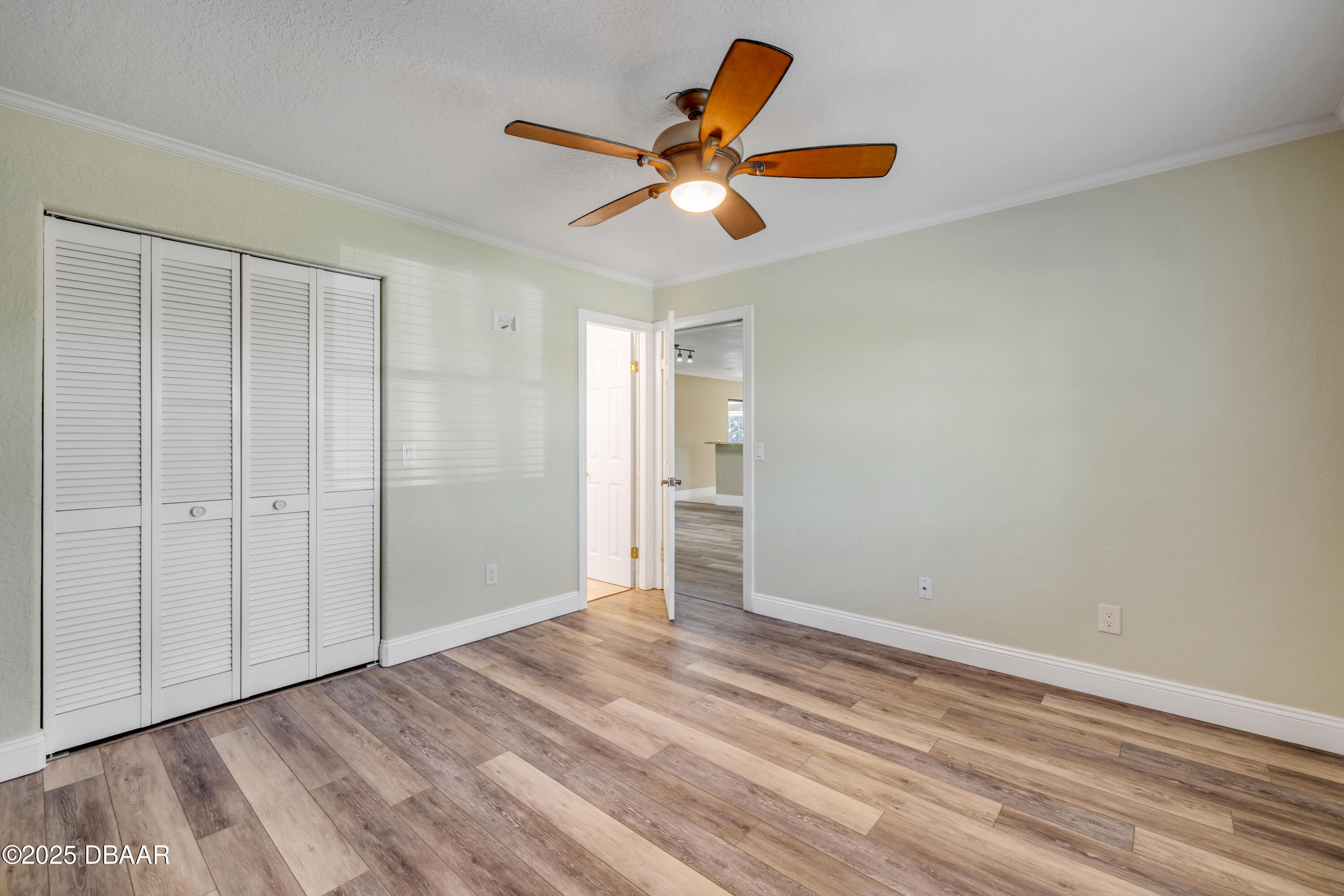 1617 Hontoon Road DeLand, FL 32720 - Photo 17 of 43 wooden floor in an empty room with a window
