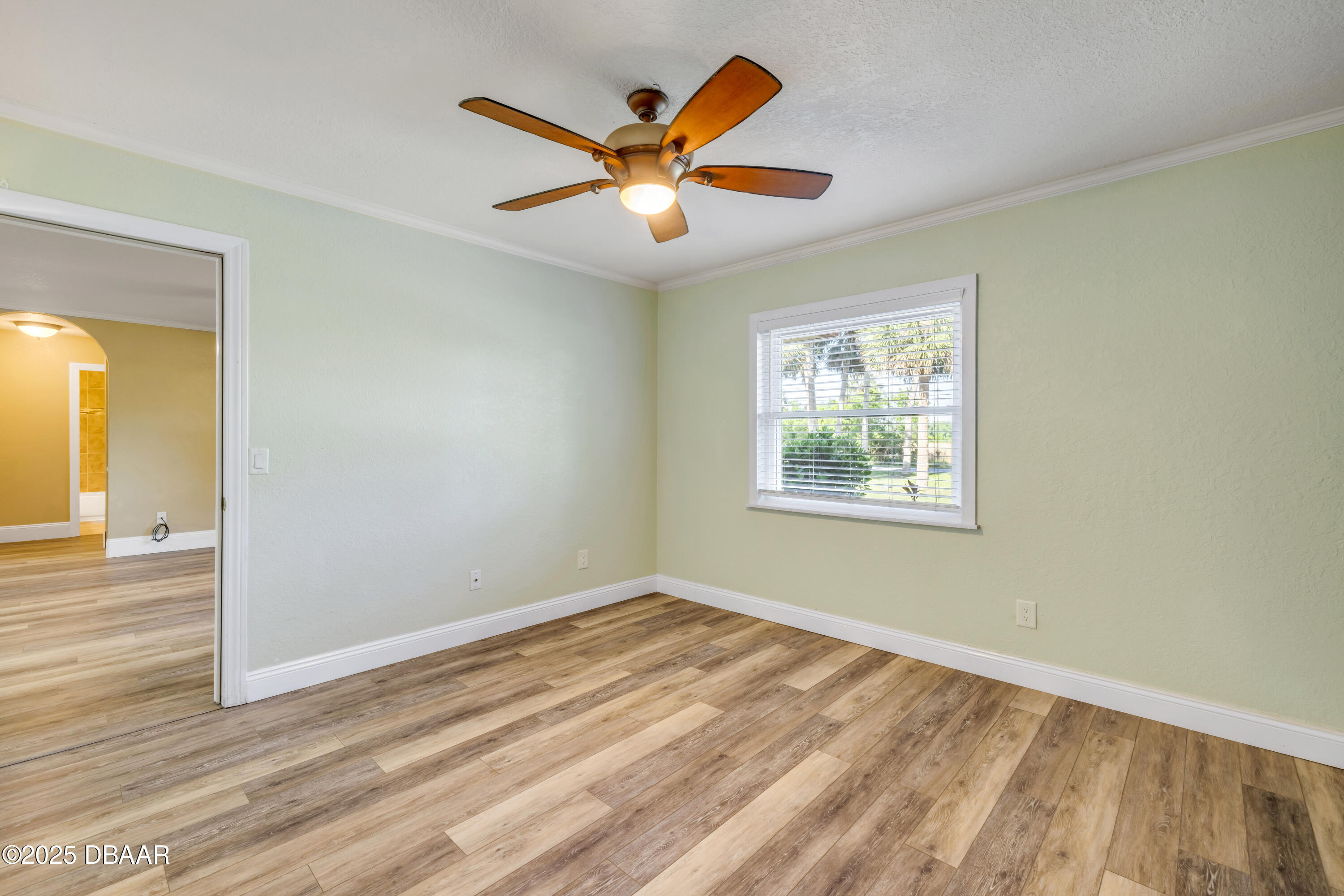 1617 Hontoon Road DeLand, FL 32720 - Photo 18 of 43 wooden floor in an empty room with a window