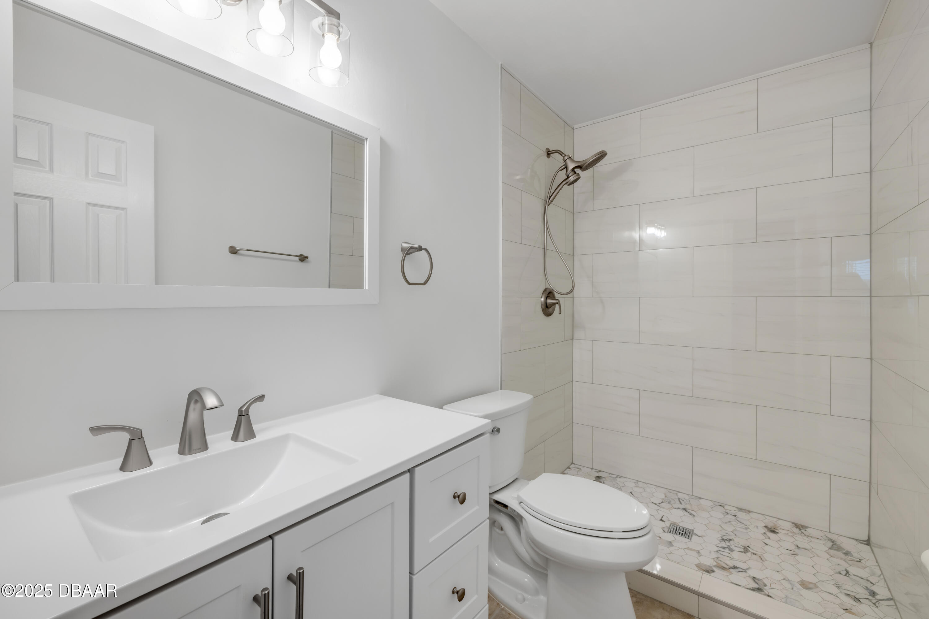1617 Hontoon Road DeLand, FL 32720 - Photo 19 of 43 a bathroom with a sink toilet and shower
