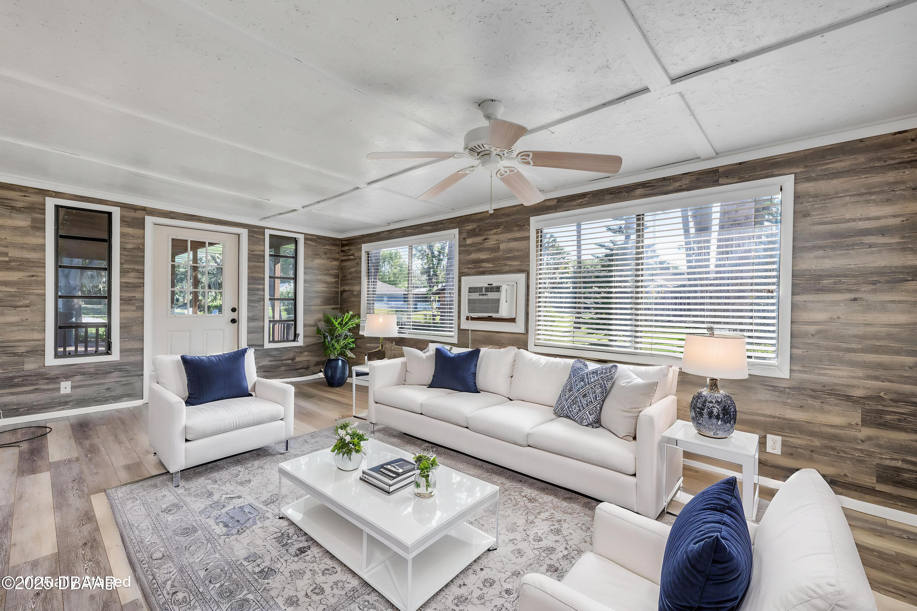1617 Hontoon Road DeLand, FL 32720 - Photo 20 of 43 a living room with furniture and a large window