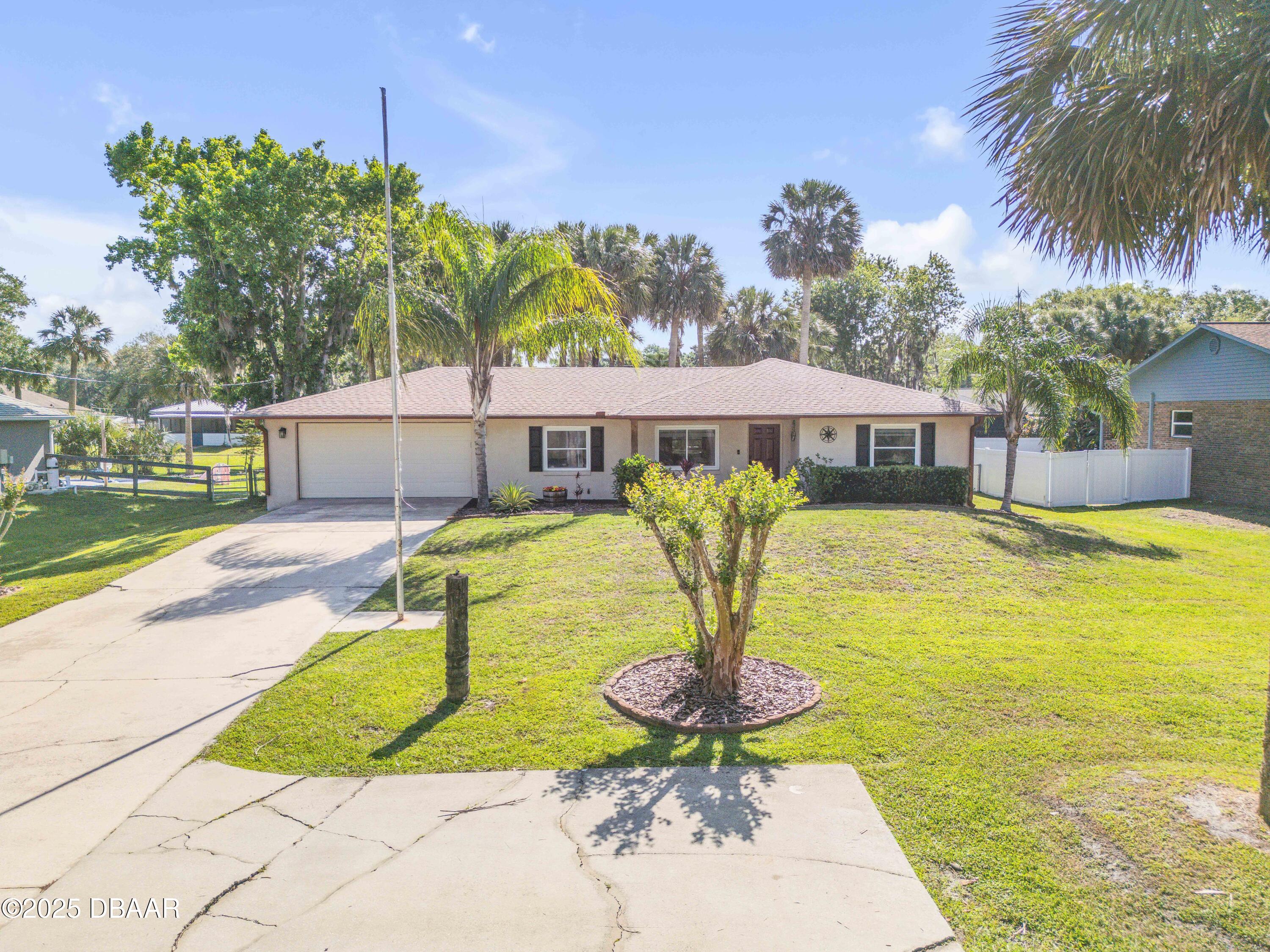 1617 Hontoon Road DeLand, FL 32720 - Photo 2 of 43 a swimming pool with outdoor seating and yard