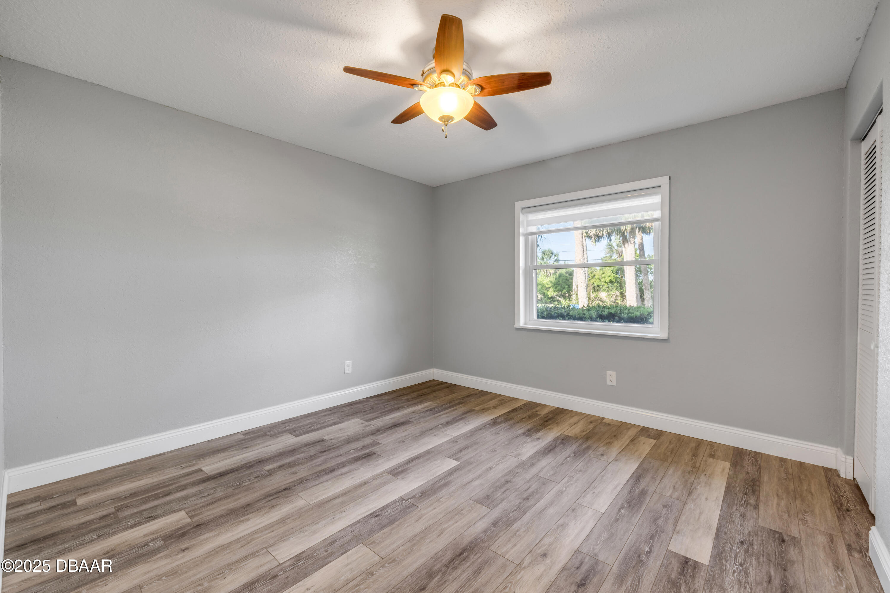 1617 Hontoon Road DeLand, FL 32720 - Photo 23 of 43 wooden floor in an empty room with a window