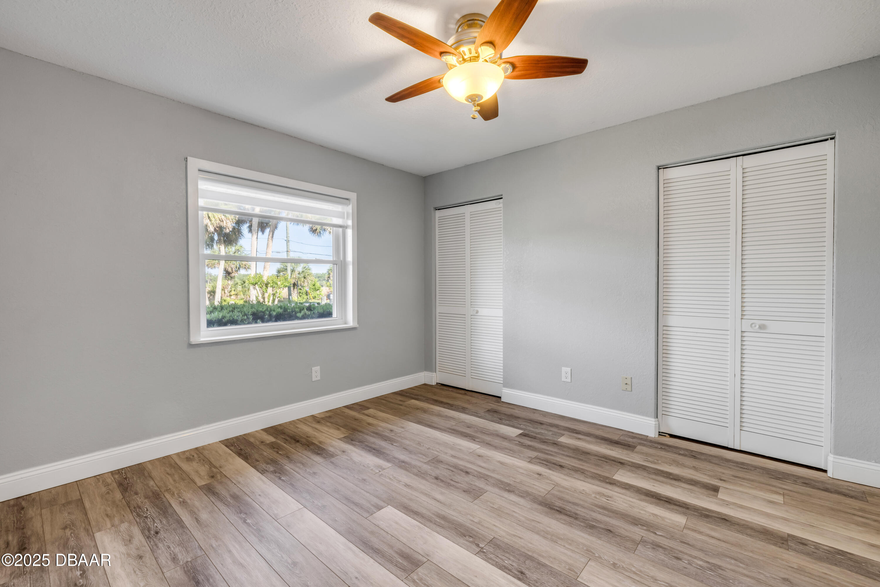 1617 Hontoon Road DeLand, FL 32720 - Photo 24 of 43 a view of an empty room with window and wooden floor