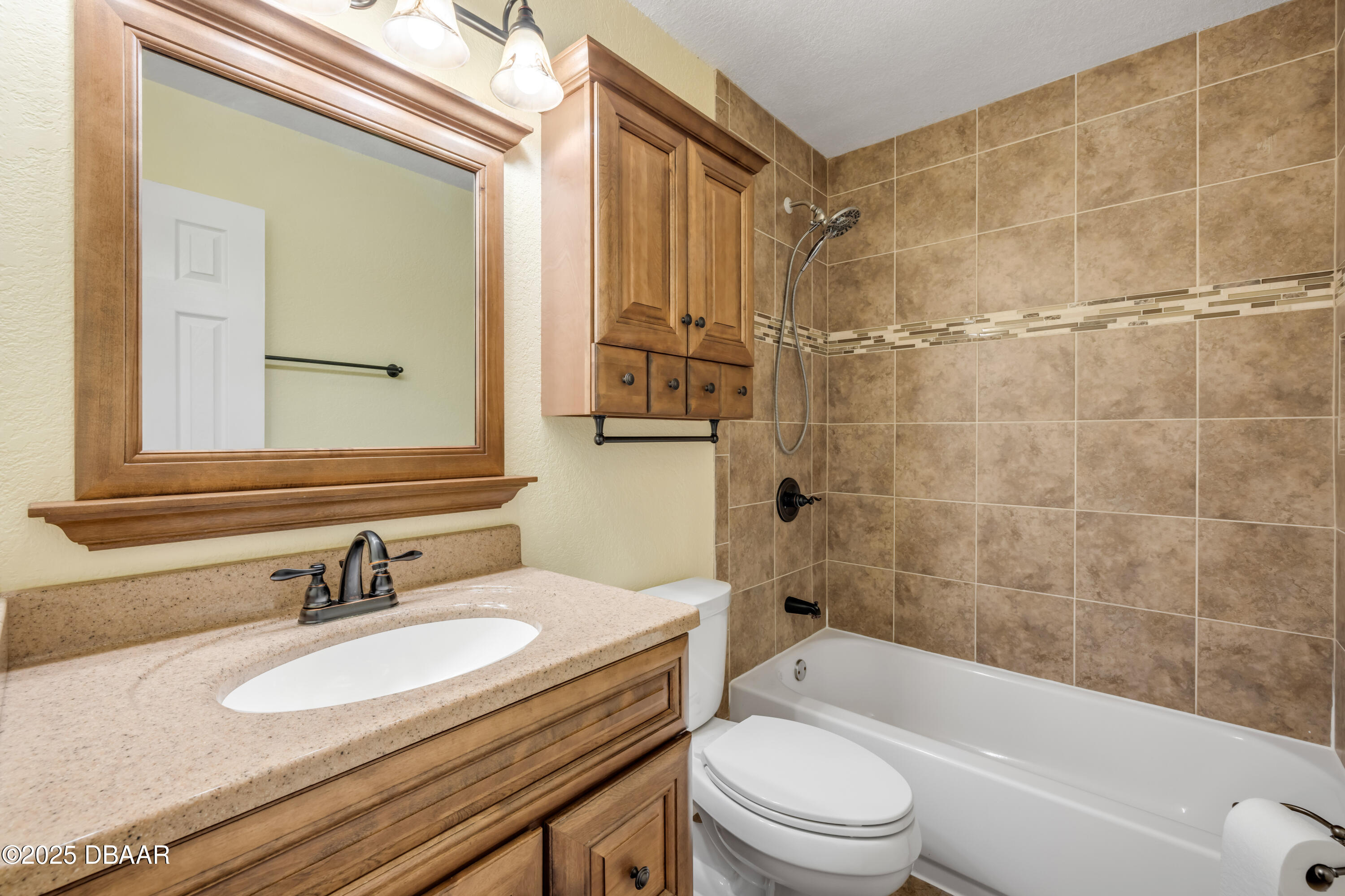 1617 Hontoon Road DeLand, FL 32720 - Photo 26 of 43 a bathroom with a sink a toilet and bathtub