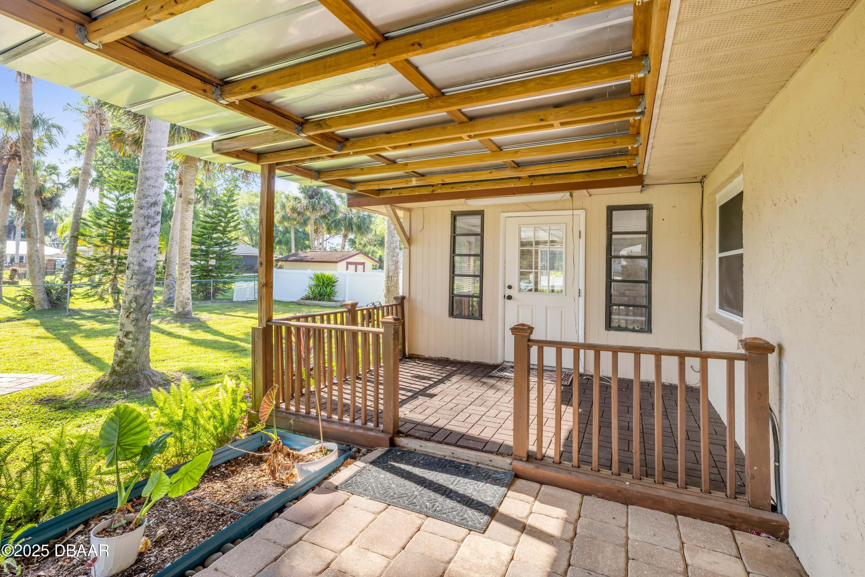 1617 Hontoon Road DeLand, FL 32720 - Photo 32 of 43 a view of a porch with wooden floor