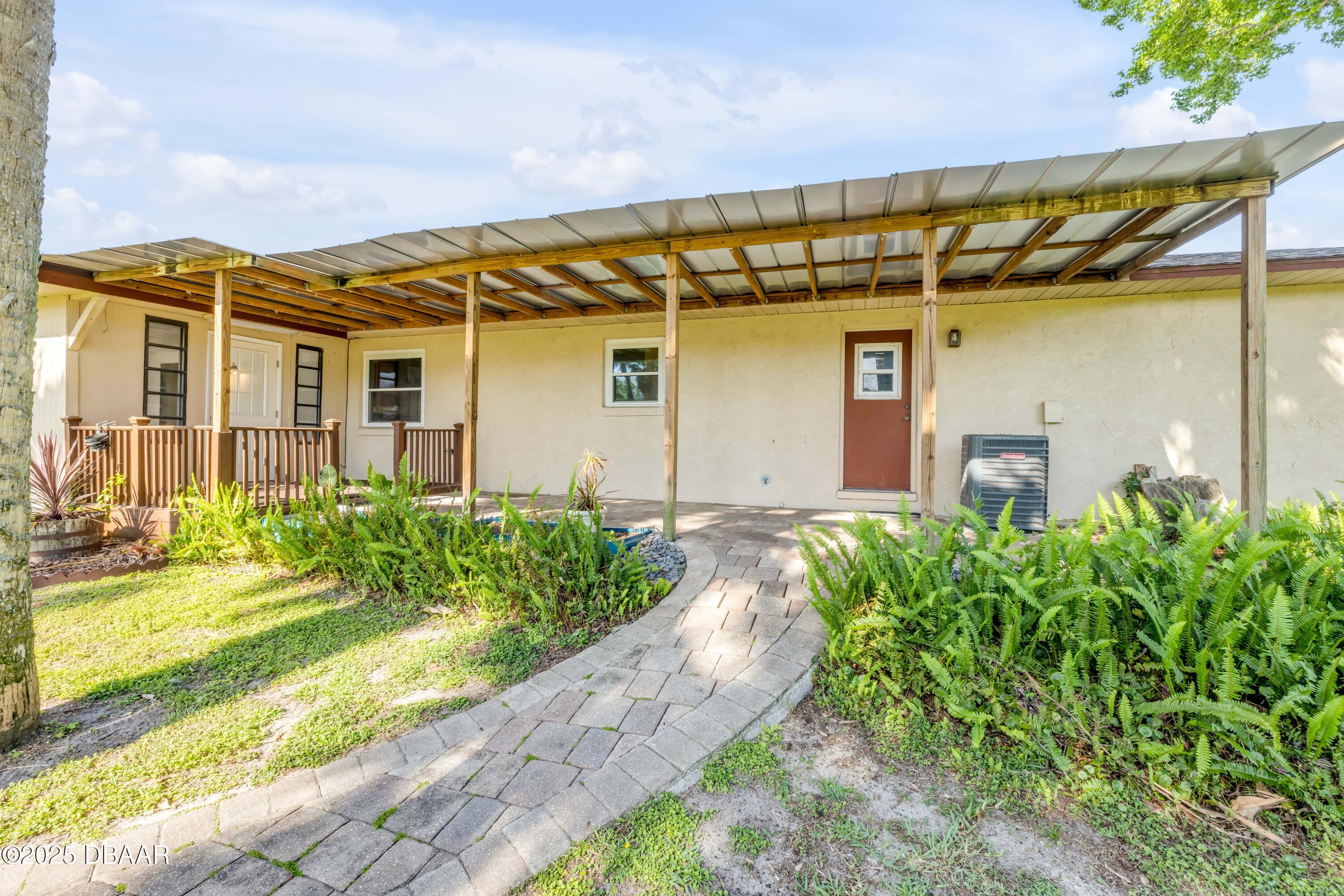 1617 Hontoon Road DeLand, FL 32720 - Photo 34 of 43 a front view of a house with garden