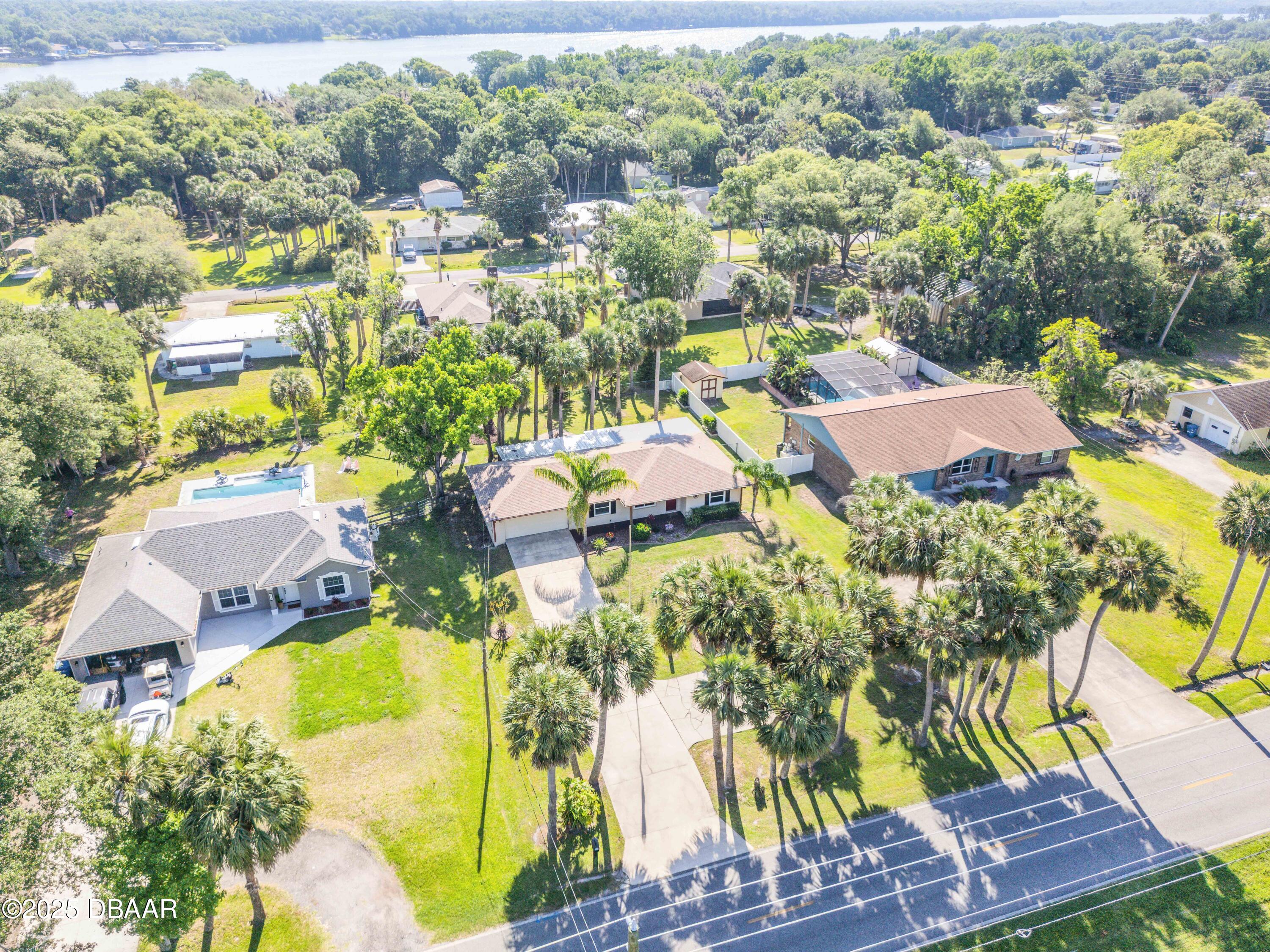 1617 Hontoon Road DeLand, FL 32720 - Photo 4 of 43 an aerial view of residential houses with outdoor space and swimming pool