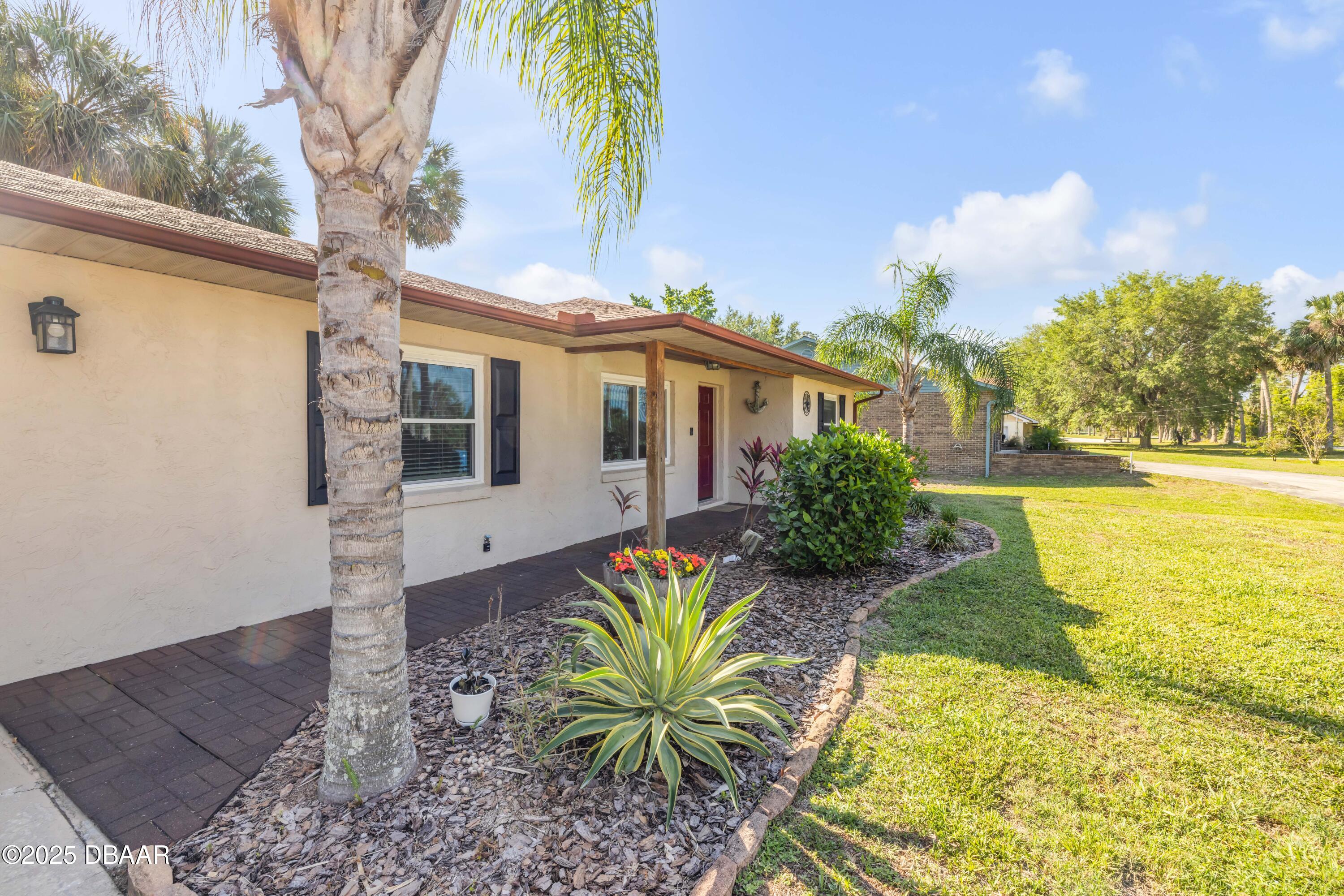 1617 Hontoon Road DeLand, FL 32720 - Photo 8 of 43 a view of a house with a yard