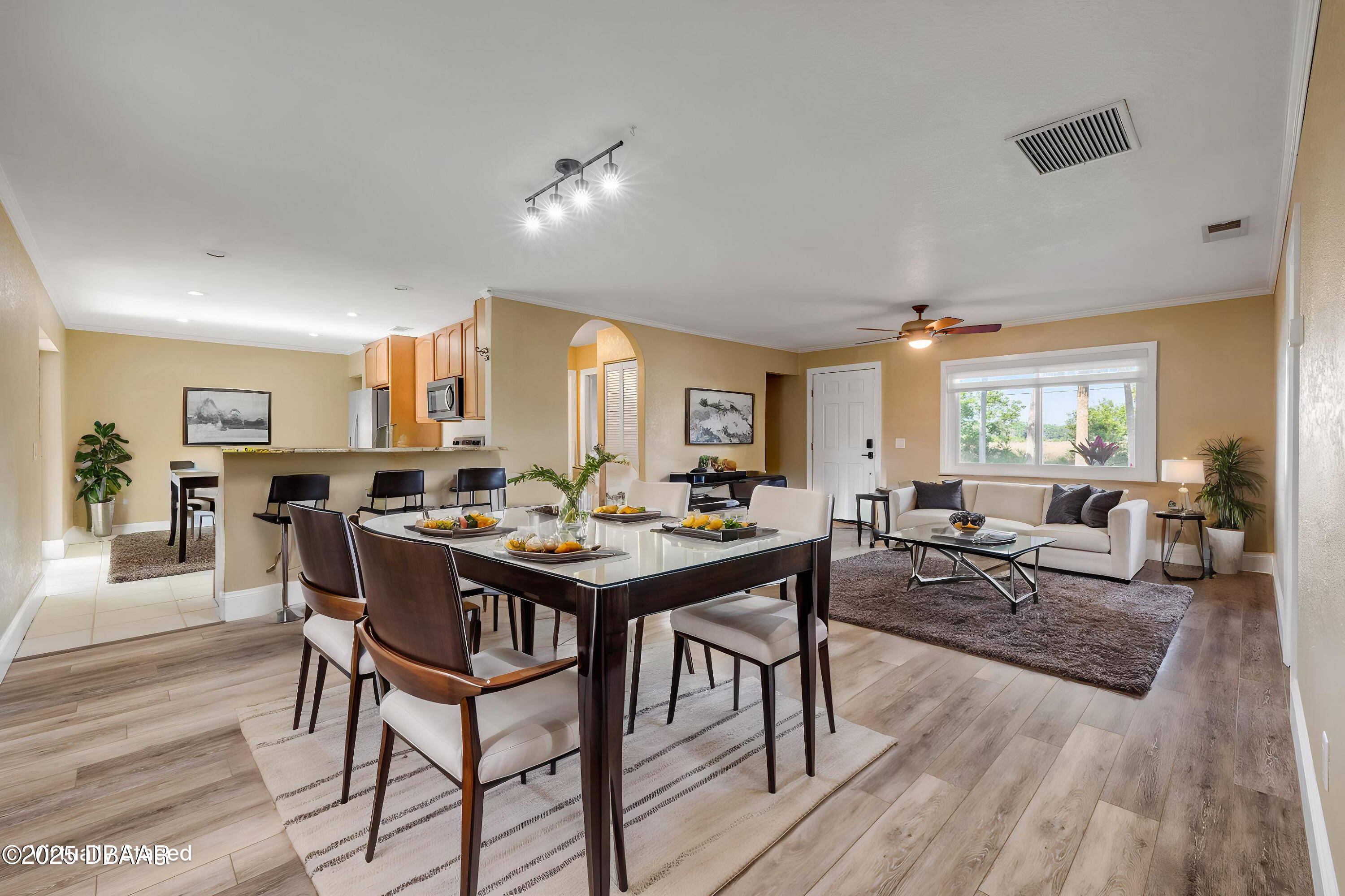 1617 Hontoon Road DeLand, FL 32720 - Photo 10 of 43 a view of a dining room with furniture and wooden floor