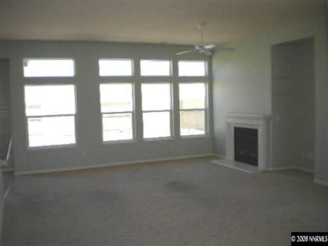 1607 Sewell Drive Reno, NV 89521 - Photo 3 of 8 an empty room with large windows