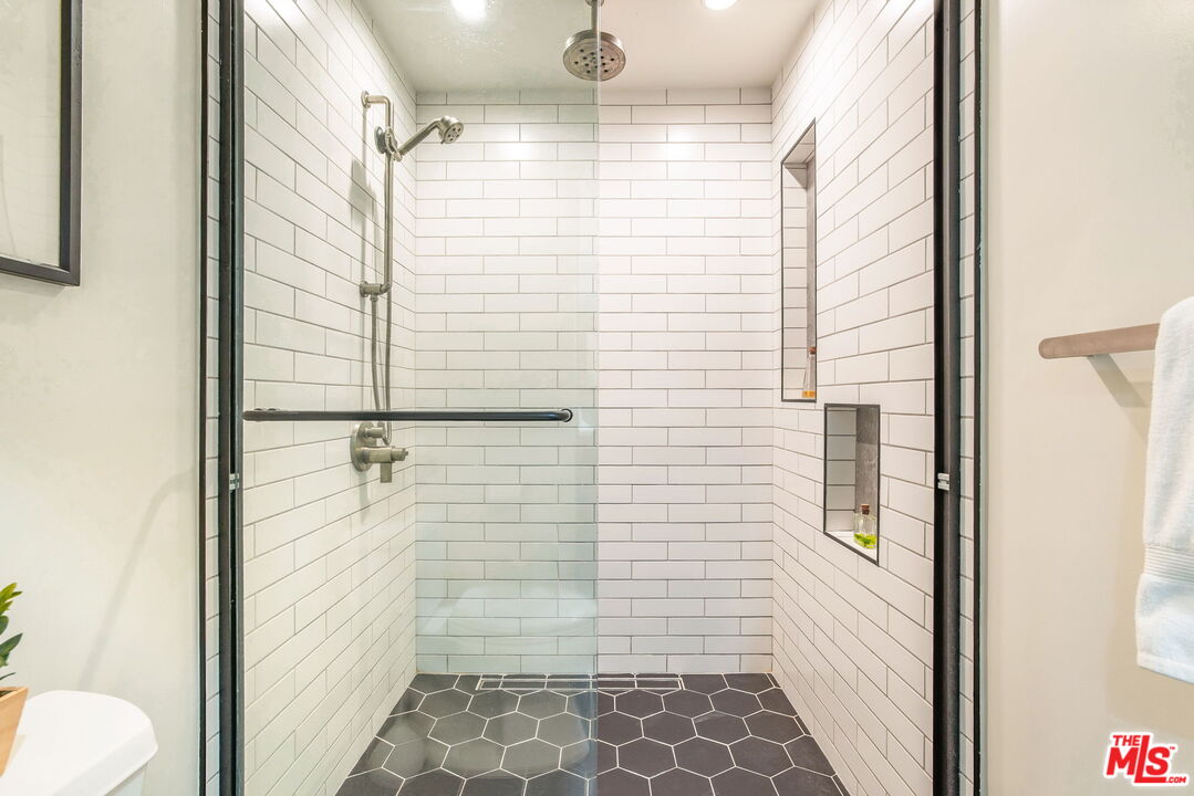 11805 Mayfield Avenue, Unit 202 Los Angeles, CA 90049 - Photo 11 of 17 a bathroom with a shower