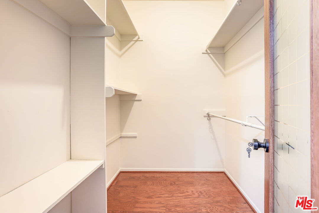 11805 Mayfield Avenue, Unit 202 Los Angeles, CA 90049 - Photo 13 of 17 wooden floor in an empty room