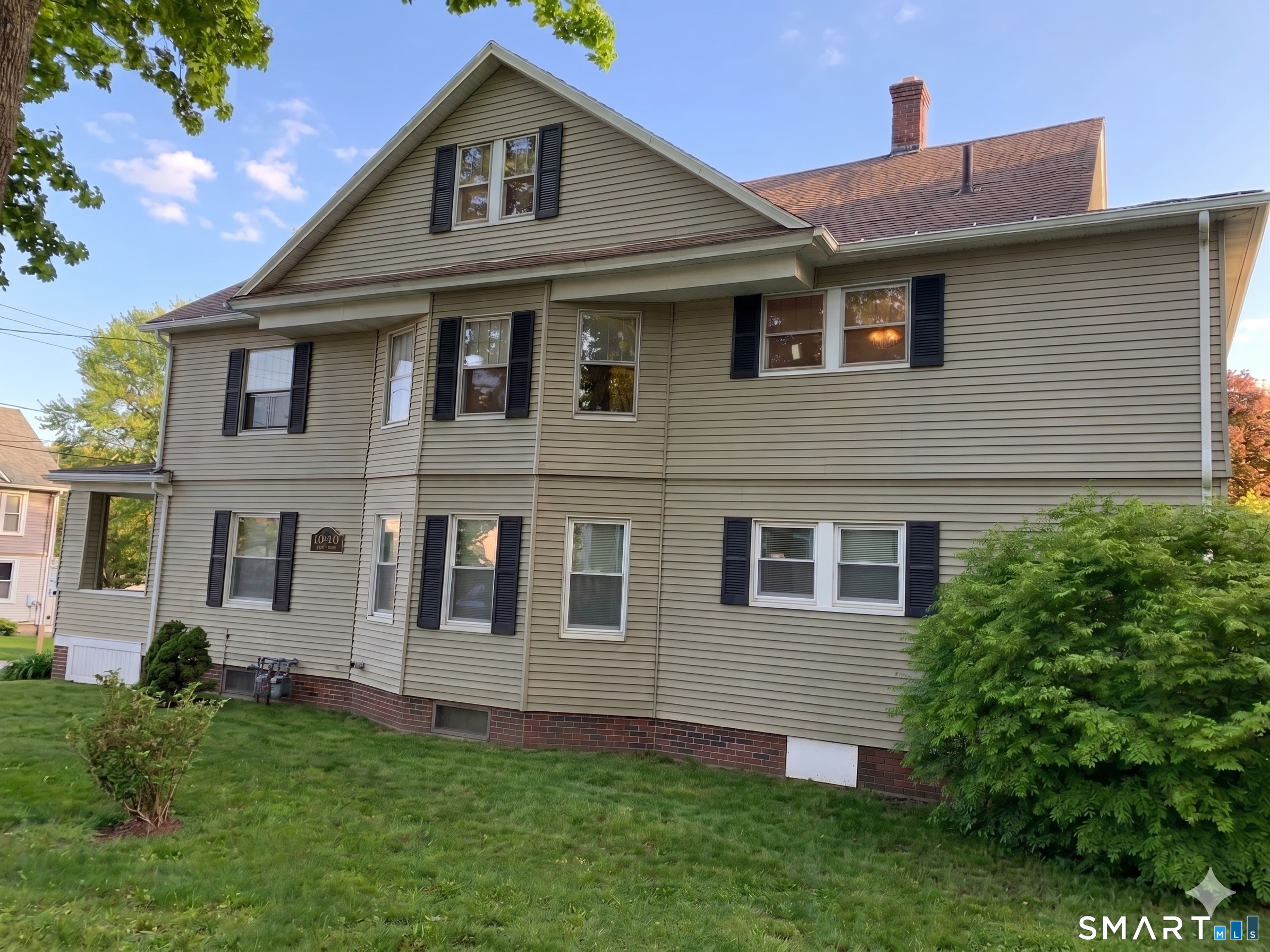 44 Bird Street Torrington, CT 06790 - Photo 1 of 17 a front view of a house with a garden