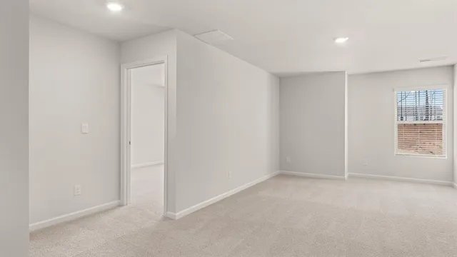 a white bath tub sitting next to a white sink