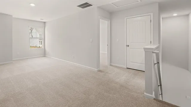 a bathroom with a shower and a glass door