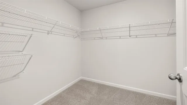 a front view of a house with a yard table and chairs