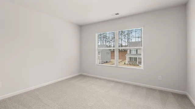 a view of a balcony with two chairs and a table