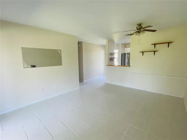 a view of a big room with windows and cabinet