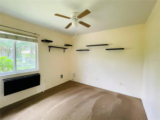 a view of a room with a dishwasher and a window