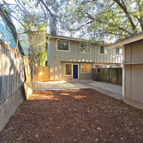 a view of a back yard of the house