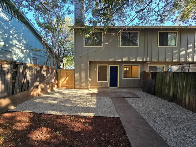 a view of a house with a yard and garage