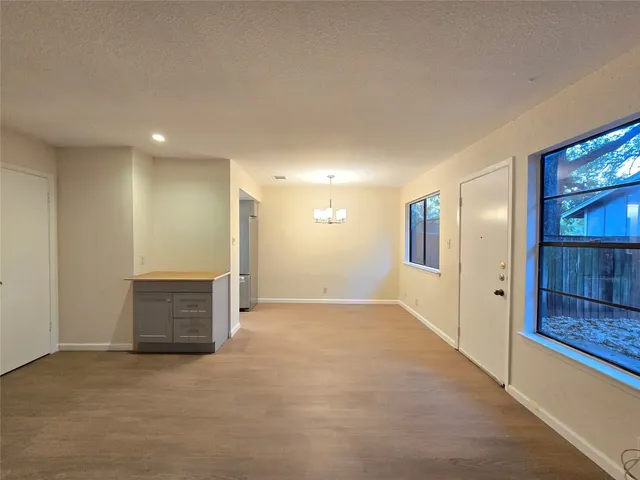 a view of empty room with fireplace
