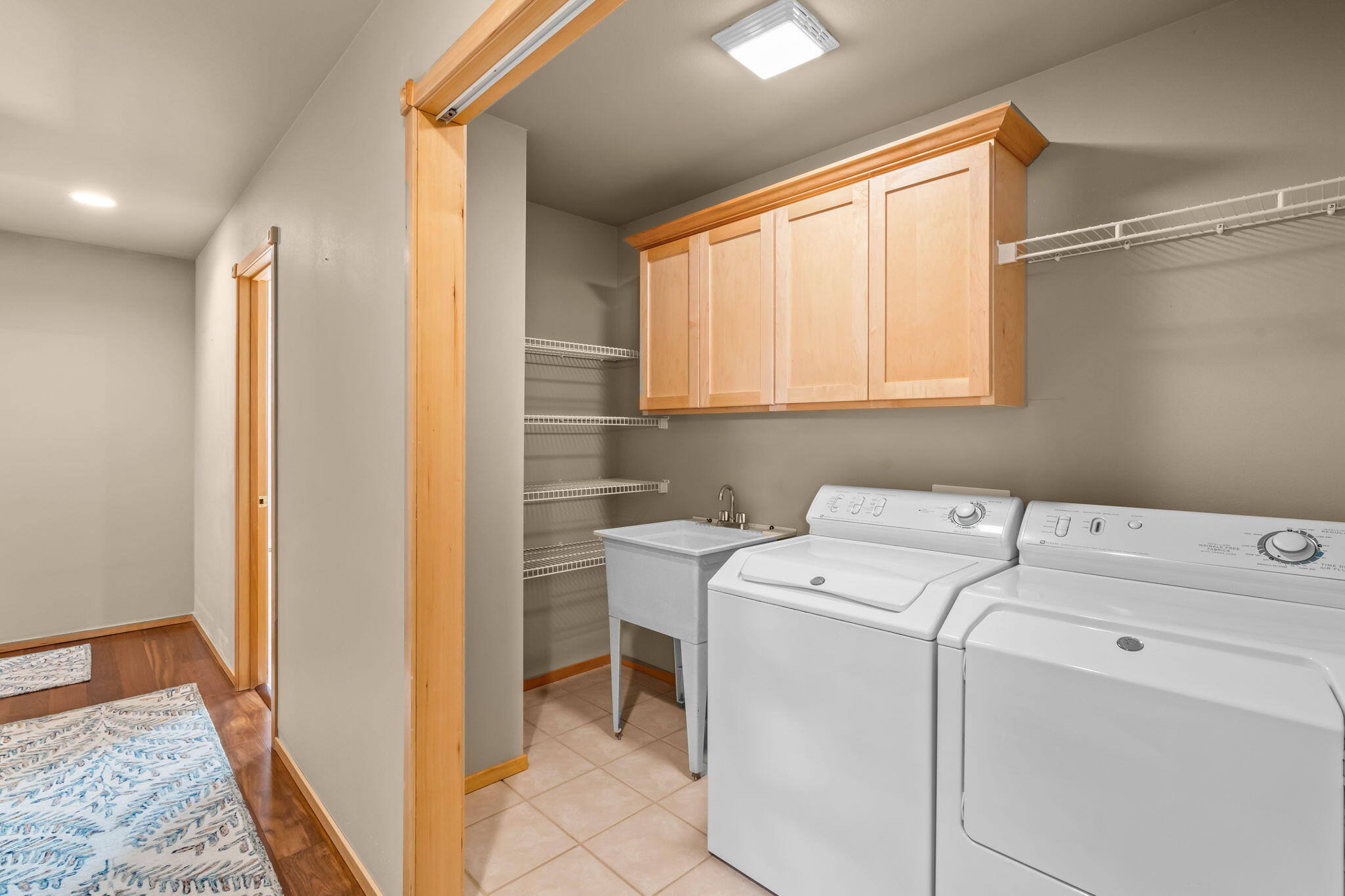 17555 Mountain View Road Sisters, OR 97759 - Photo 31 of 50 Utility Sink, cabinets and storage in the large Laundry closet.