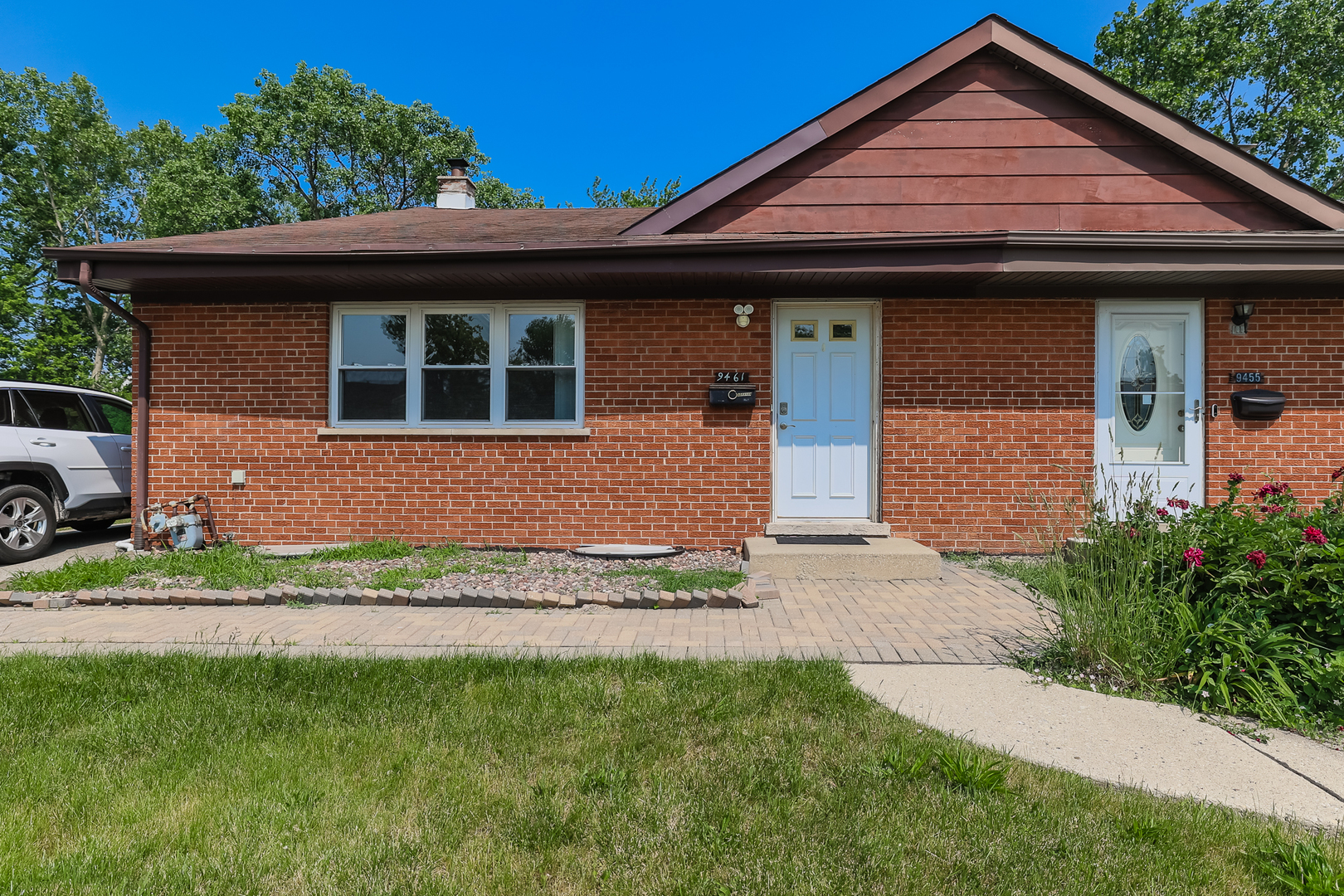 a front view of a house with a yard
