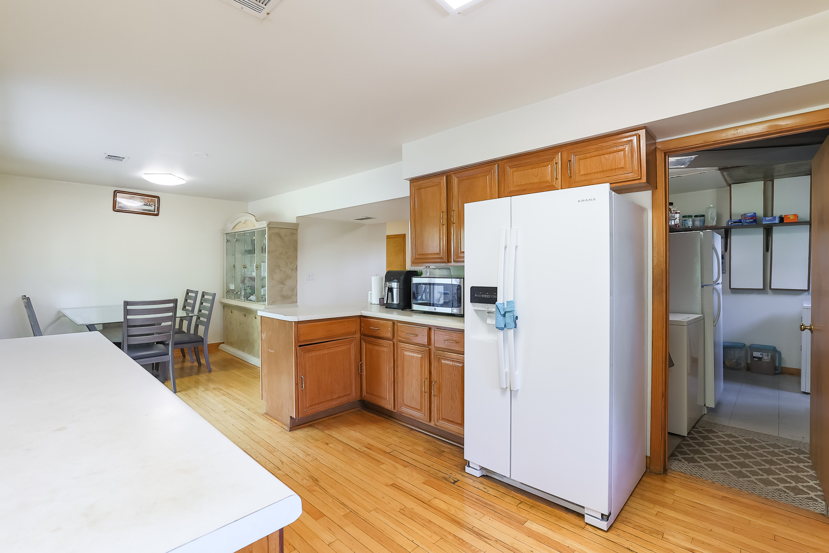 9461 Dee Road Des Plaines, IL 60016 - Photo 19 of 26 a kitchen with stainless steel appliances a refrigerator and a stove top oven