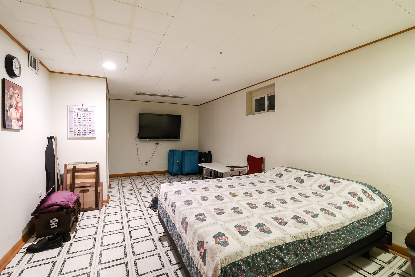 9461 Dee Road Des Plaines, IL 60016 - Photo 23 of 26 a bedroom with a bed and a flat screen tv