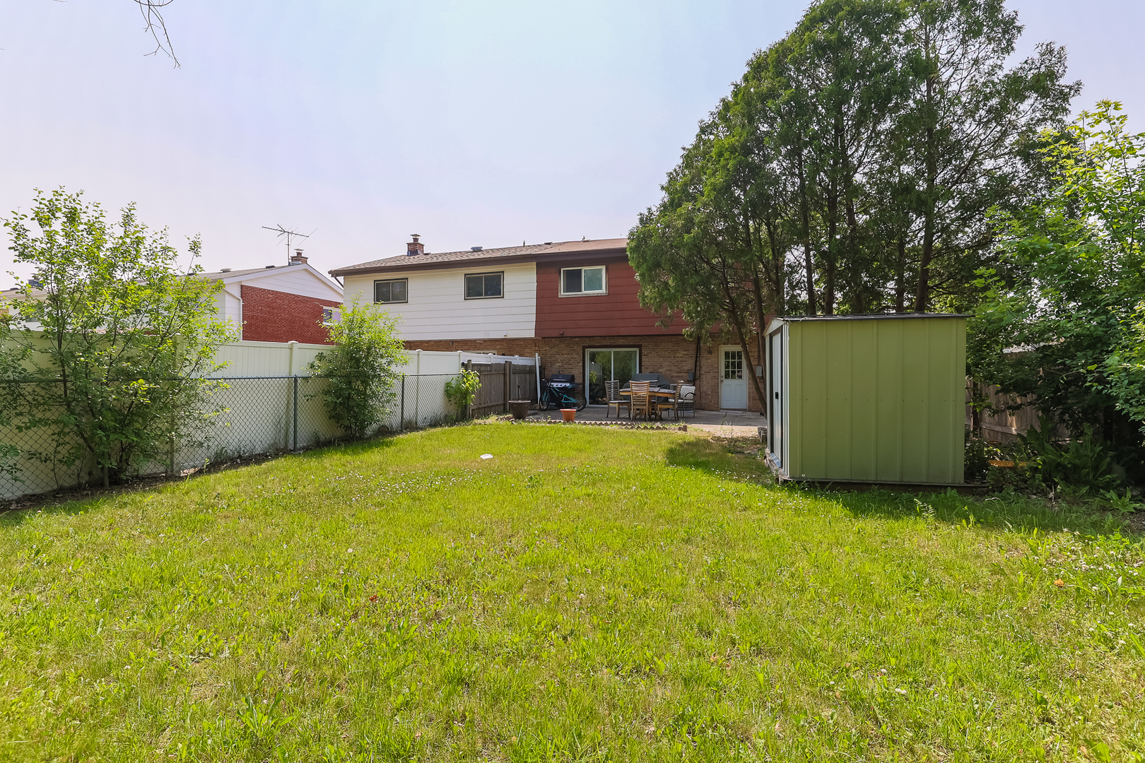 9461 Dee Road Des Plaines, IL 60016 - Photo 26 of 26 a swimming pool with outdoor seating and yard