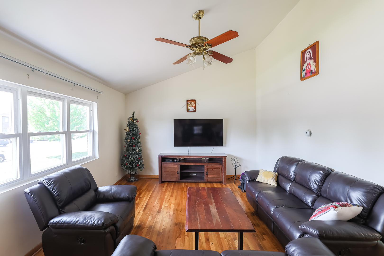 9461 Dee Road Des Plaines, IL 60016 - Photo 7 of 26 a living room with furniture and a flat screen tv