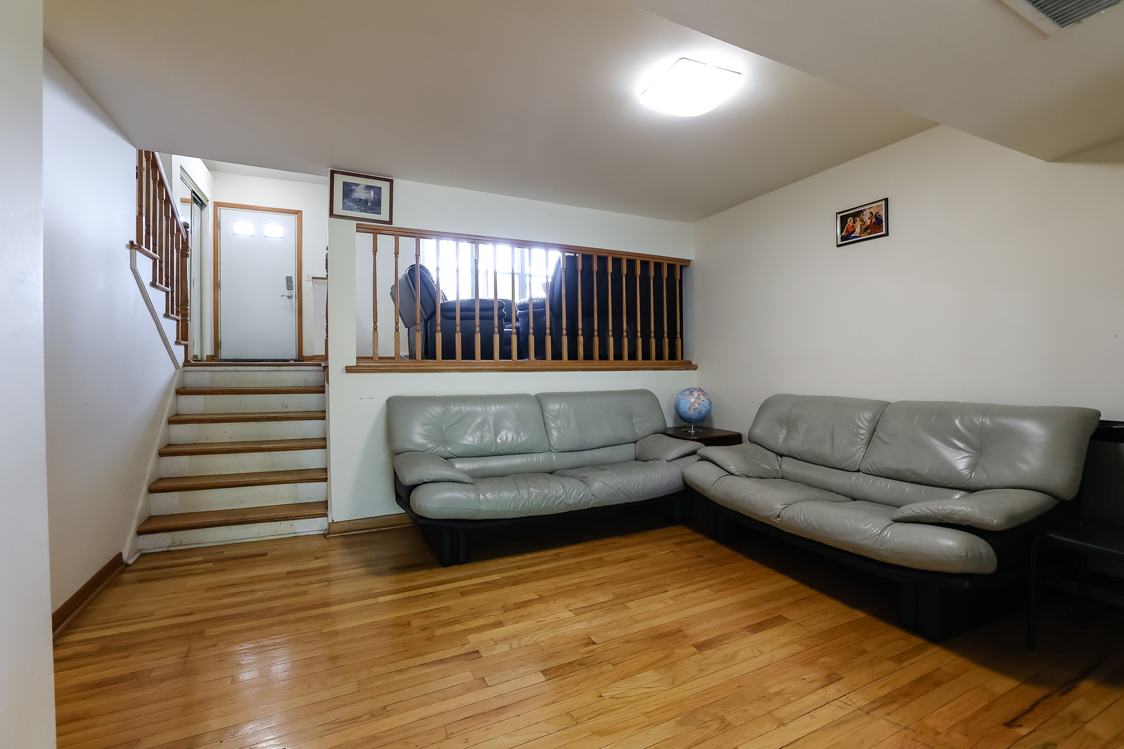 9461 Dee Road Des Plaines, IL 60016 - Photo 8 of 26 a living room with furniture and a wooden floor