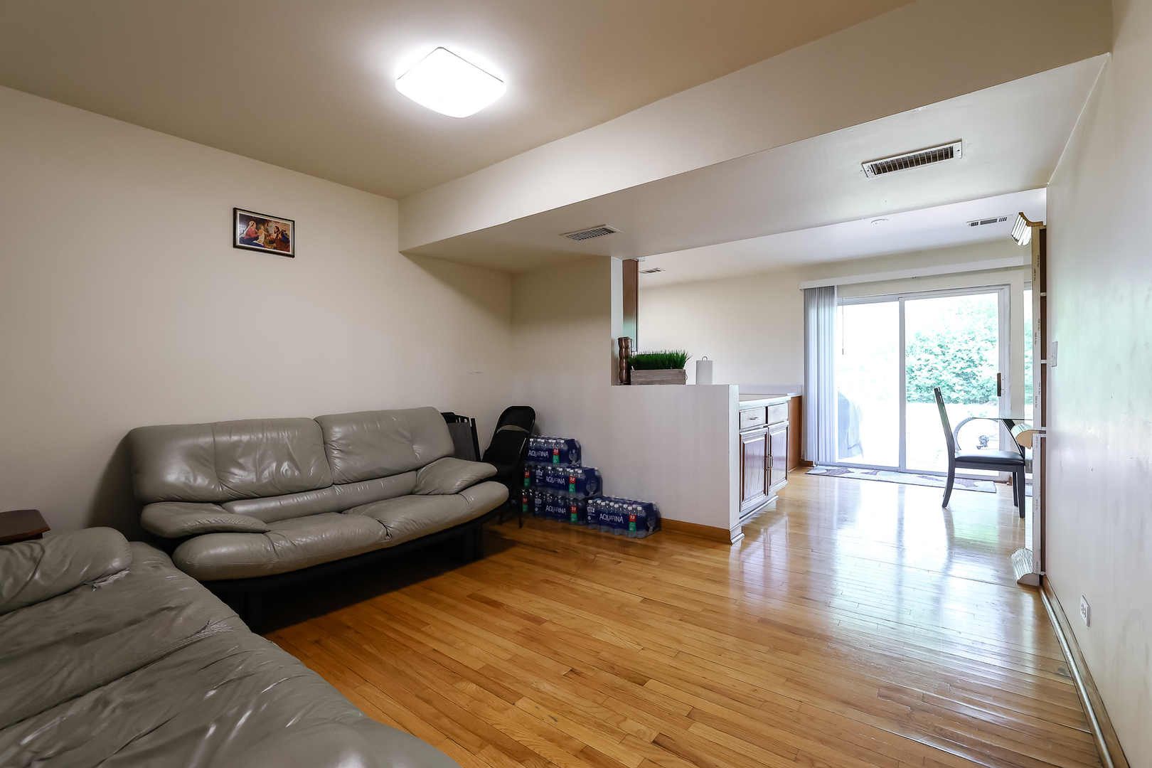 9461 Dee Road Des Plaines, IL 60016 - Photo 9 of 26 a living room with furniture and a wooden floor
