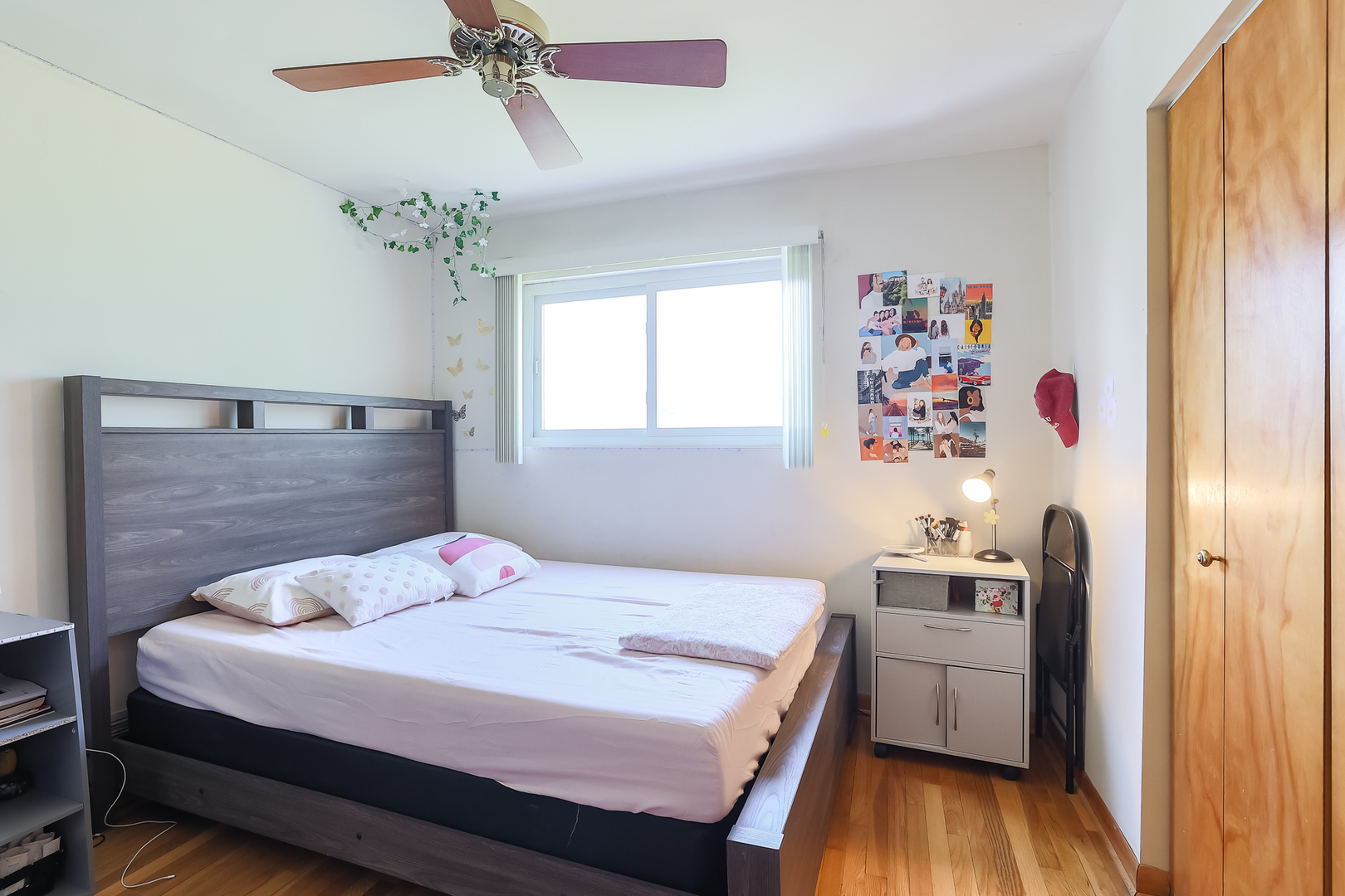 9461 Dee Road Des Plaines, IL 60016 - Photo 10 of 26 a bedroom with a bed and a window