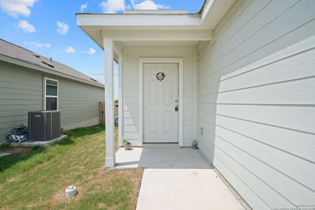 a view of house with backyard