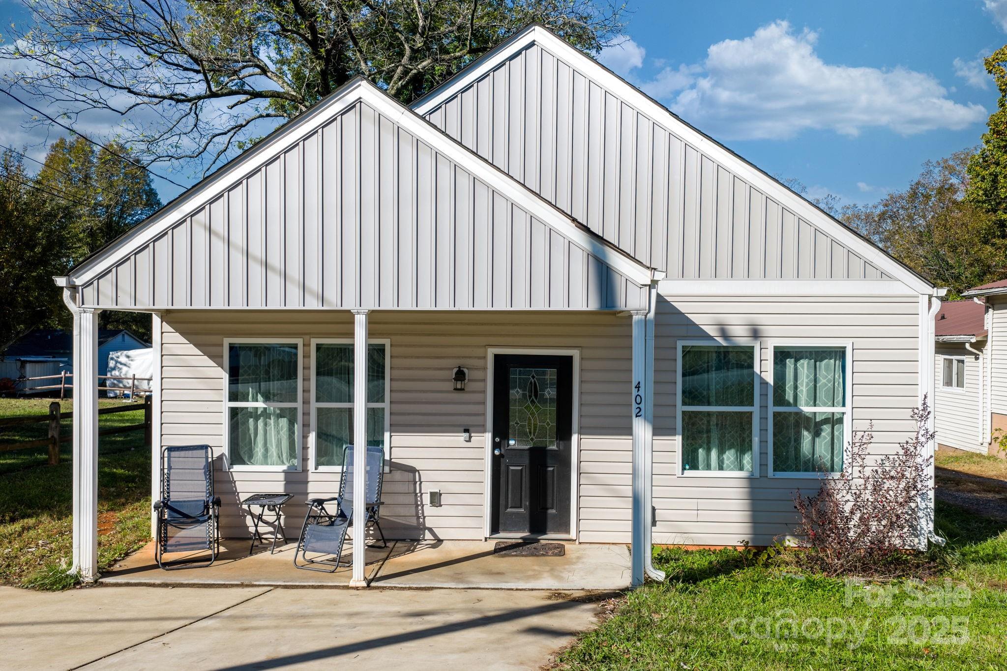 402 2nd Street Southwest Hickory, NC 28602 - Photo 1 of 24 a front view of a house with a yard