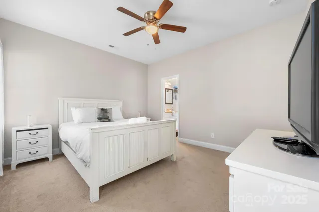 a white bed sitting in a room