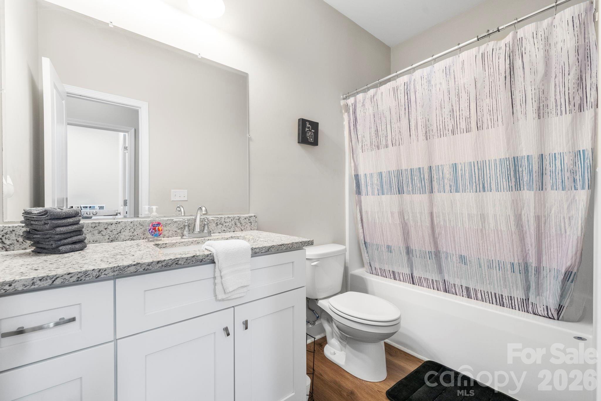 402 2nd Street Southwest Hickory, NC 28602 - Photo 15 of 24 a bathroom with a toilet a sink and a bathtub